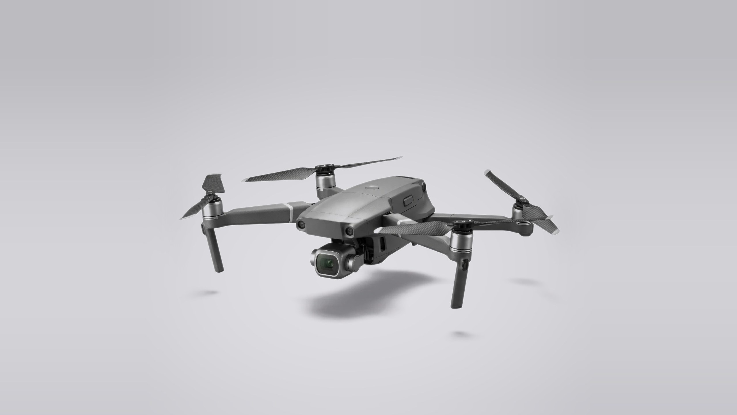 The Caddi drone, a compact folding quadcopter, against a soft studio backdrop.